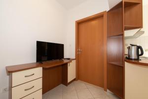 Kuchyň nebo kuchyňský kout v ubytování Apartmani Biser