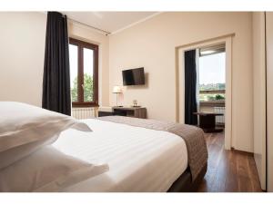 Un pat sau paturi într-o cameră la Window On Rome