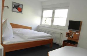 Tempat tidur dalam kamar di Apartment-Haus