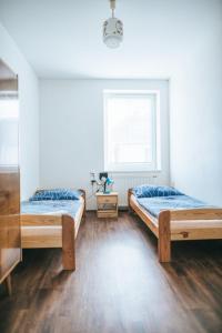 Ένα ή περισσότερα κρεβάτια σε δωμάτιο στο Klub U Námořníka