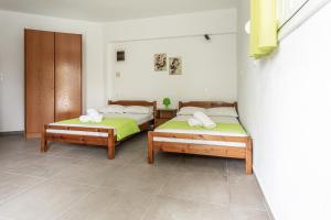 Posteľ alebo postele v izbe v ubytovaní Mike's Apartments
