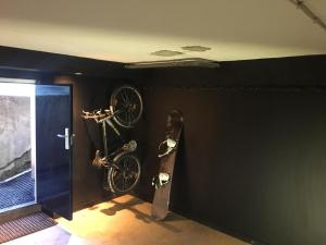 a bike hanging on a wall next to a door at Die zwei Löwen Ferienwohnungen in Winterberg