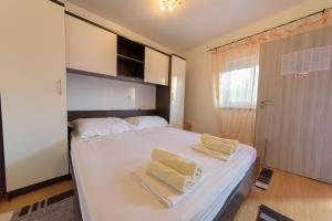 Postel nebo postele na pokoji v ubytování Jeli Apartments