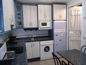 Kuchyň nebo kuchyňský kout v ubytování La casa del 7