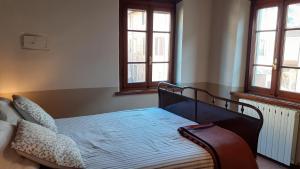 Postel nebo postele na pokoji v ubytování Casa Nostra Camaiore + 7 fotografií