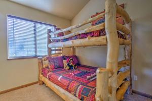 a bedroom with two bunk beds in a room at Fairplay House with Deck and Panoramic Nature Views! in Fairplay