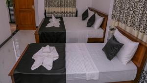 Postel nebo postele na pokoji v ubytování Sura Homestay Kandy
