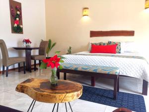 Postel nebo postele na pokoji v ubytování Mayan Majesty Boutique Hotel