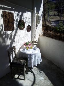 a table in a room with a table and chairs at Aggelina in Sárkhos