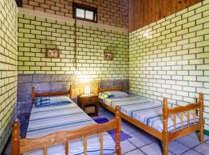 Ένα ή περισσότερα κρεβάτια σε δωμάτιο στο Punta Canoa cabanas