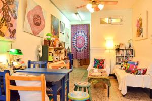 a living room with a table and a couch at La Pace Hostel in Taitung City