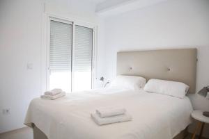 Ένα ή περισσότερα κρεβάτια σε δωμάτιο στο Samara 33 - Solarium +13 φωτογραφίες