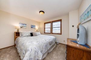 a bedroom with a bed and a tv in it at Sea Breeze in Lincoln City