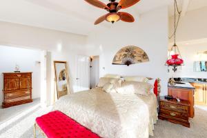 a bedroom with a bed and a ceiling fan at Misty Rose in Fort Bragg