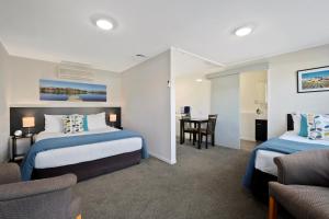 Letto o letti in una camera di Central Gateway Motel