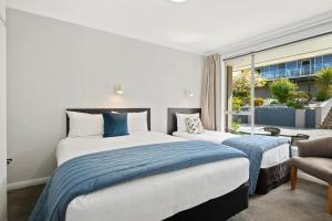 Letto o letti in una camera di Central Gateway Motel