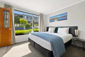 Letto o letti in una camera di Central Gateway Motel