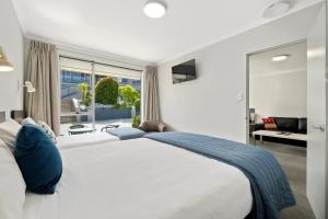 Letto o letti in una camera di Central Gateway Motel
