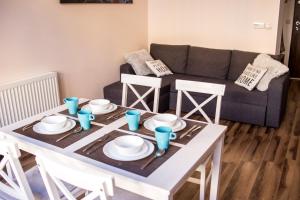 Posedenie v ubytovaní Voal Apartamenty