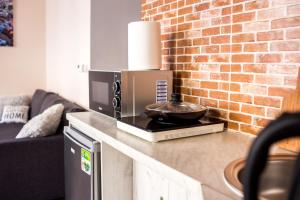 Kuchyňa alebo kuchynka v ubytovaní Voal Apartamenty