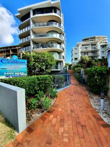 
a brick building with a view of a city at Cerulean Apartments in Caloundra
