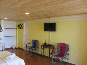 TV a/nebo společenská místnost v ubytování Ecohotel, Finca Colinas y Senderos