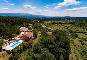 an aerial view of a house with a swimming pool at Villa Brapa - open swimming pool in Hrvace