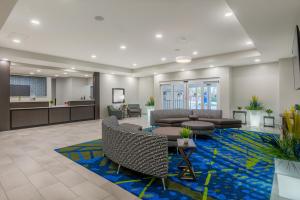 an office lobby with couches and a waiting room at Candlewood Suites Cookeville by IHG in Cookeville