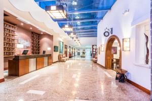 a hallway in a building with a library at Holiday Inn Express Quito by IHG in Quito