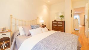 Ένα ή περισσότερα κρεβάτια σε δωμάτιο στο Apartamento Plaza de España