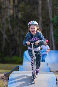 a little girl riding a scooter on a ramp at Discovery Parks - Forster in Tuncurry