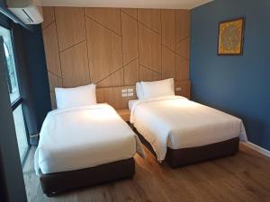 Ένα ή περισσότερα κρεβάτια σε δωμάτιο στο Hotel Fuse Rayong
