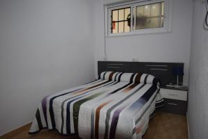 Postel nebo postele na pokoji v ubytování COMERCIAL LEPANTO - FINCAS ARENA