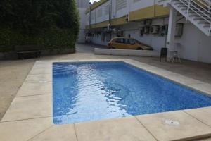 Bazén v ubytování COMERCIAL LEPANTO - FINCAS ARENA nebo v jeho okolí