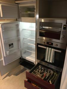 an empty refrigerator with its door open in a kitchen at Arsenale 3880 in Venice