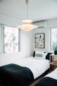 Postel nebo postele na pokoji v ubytování villa okinawa onna