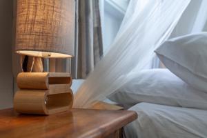 Una cama o camas en una habitación de Villa Vue Sauvage