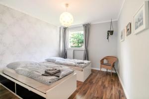 Кровать или кровати в номере Fewo-Colonia Köln-Innenstadt