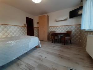 Pokoje gościnne "Lenka"客房内的一张或多张床位