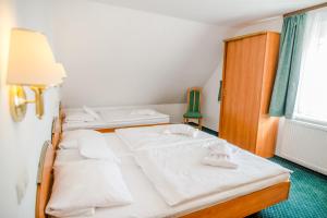 Posteľ alebo postele v izbe v ubytovaní Hotel Spindlerova Bouda