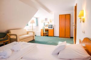 Postel nebo postele na pokoji v ubytování Hotel Spindlerova Bouda