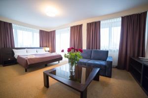 Łóżko lub łóżka w pokoju w obiekcie Hotel Avangarda