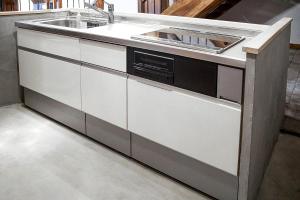 a kitchen with a sink and a counter at The Apartment Hotels KOU in Otaru