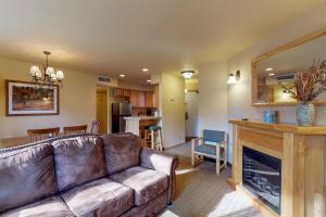 a living room with a couch and a fireplace at Aspen Suites 505 & 506: Downtown Duo in Leavenworth