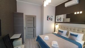 Postel nebo postele na pokoji v ubytování ANTARES Apart hotel