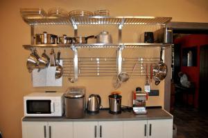 A kitchen or kitchenette at Casa Rural Mansion Adela con Piscina y Jacuzzi