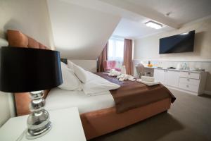 Telewizja i/lub zestaw kina domowego w obiekcie Hotel Avangarda