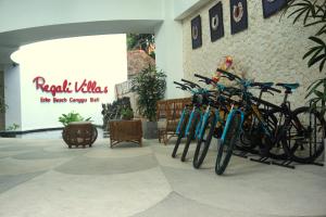 a group of bikes parked next to a building at Regali Villa Canggu in Canggu