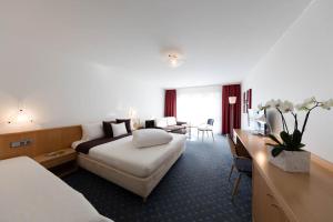 Voodi või voodid majutusasutuse Hotel Höfli toas