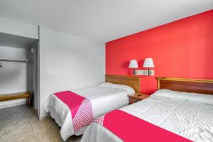 Postel nebo postele na pokoji v ubytování OYO Hotel Houston Southwest I-69